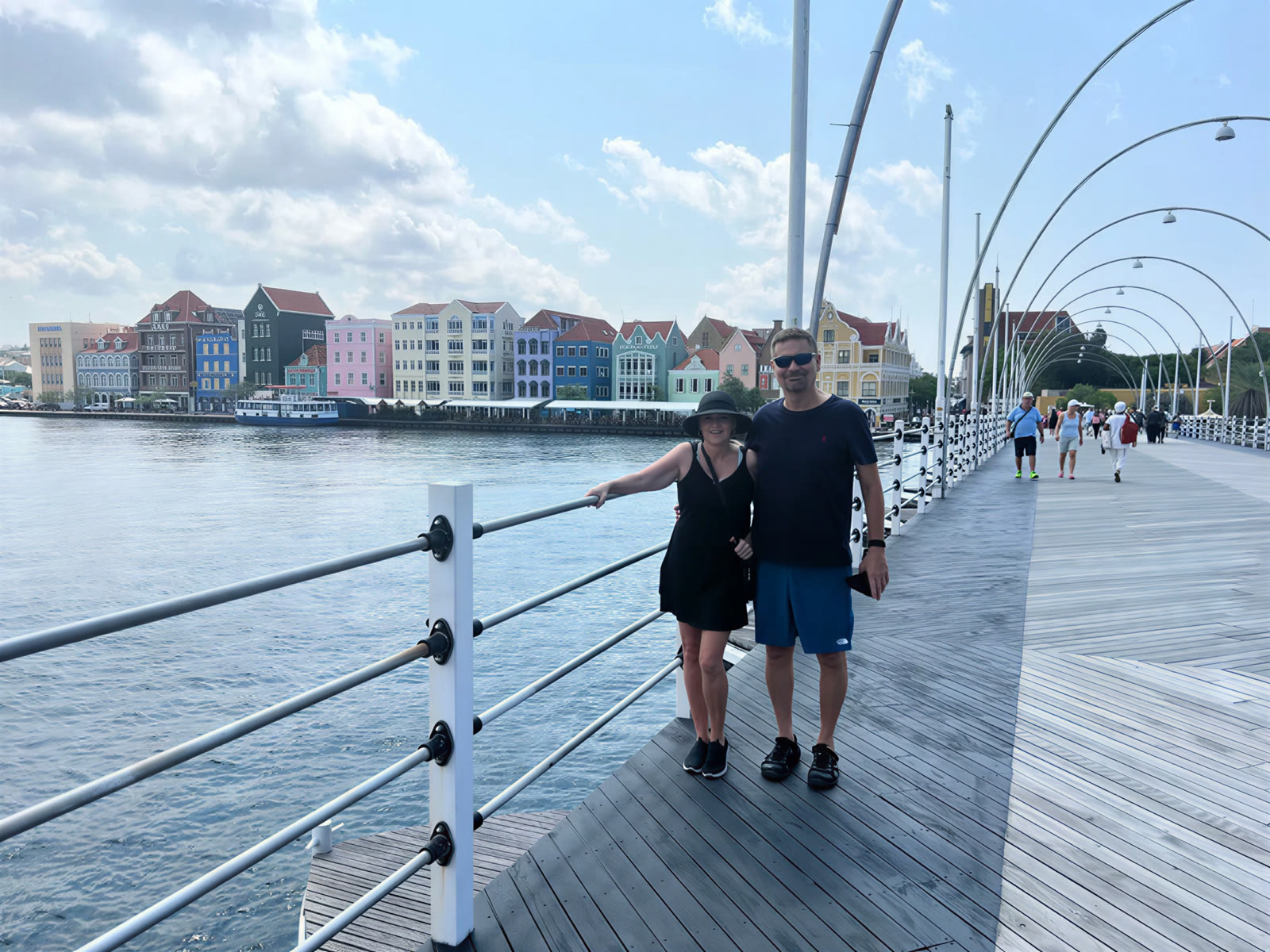 Traveler on a waterfront bridge during a trip